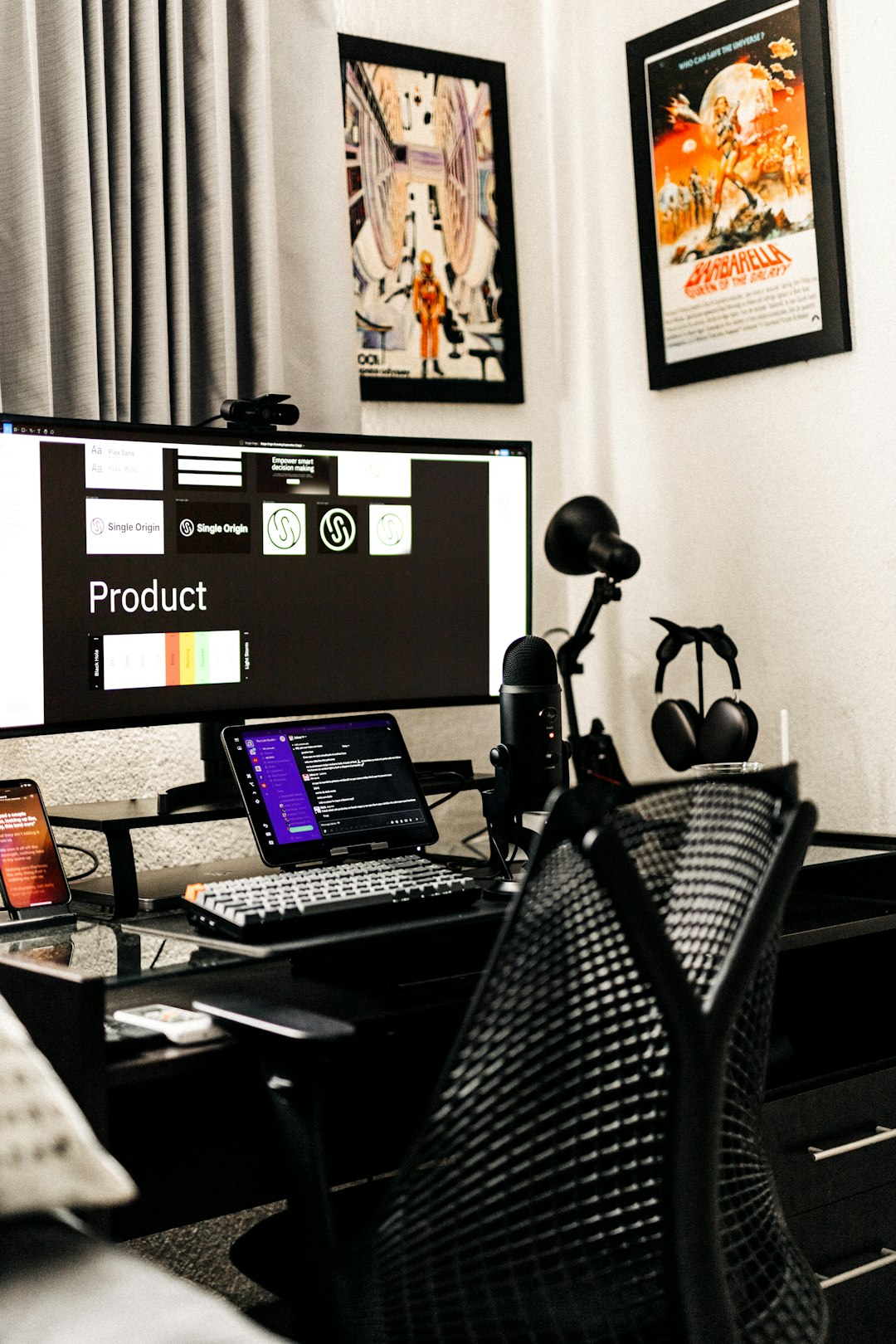 a-desk-with-a-computer-and-a-laptop-on-it-oifpmubf2lm